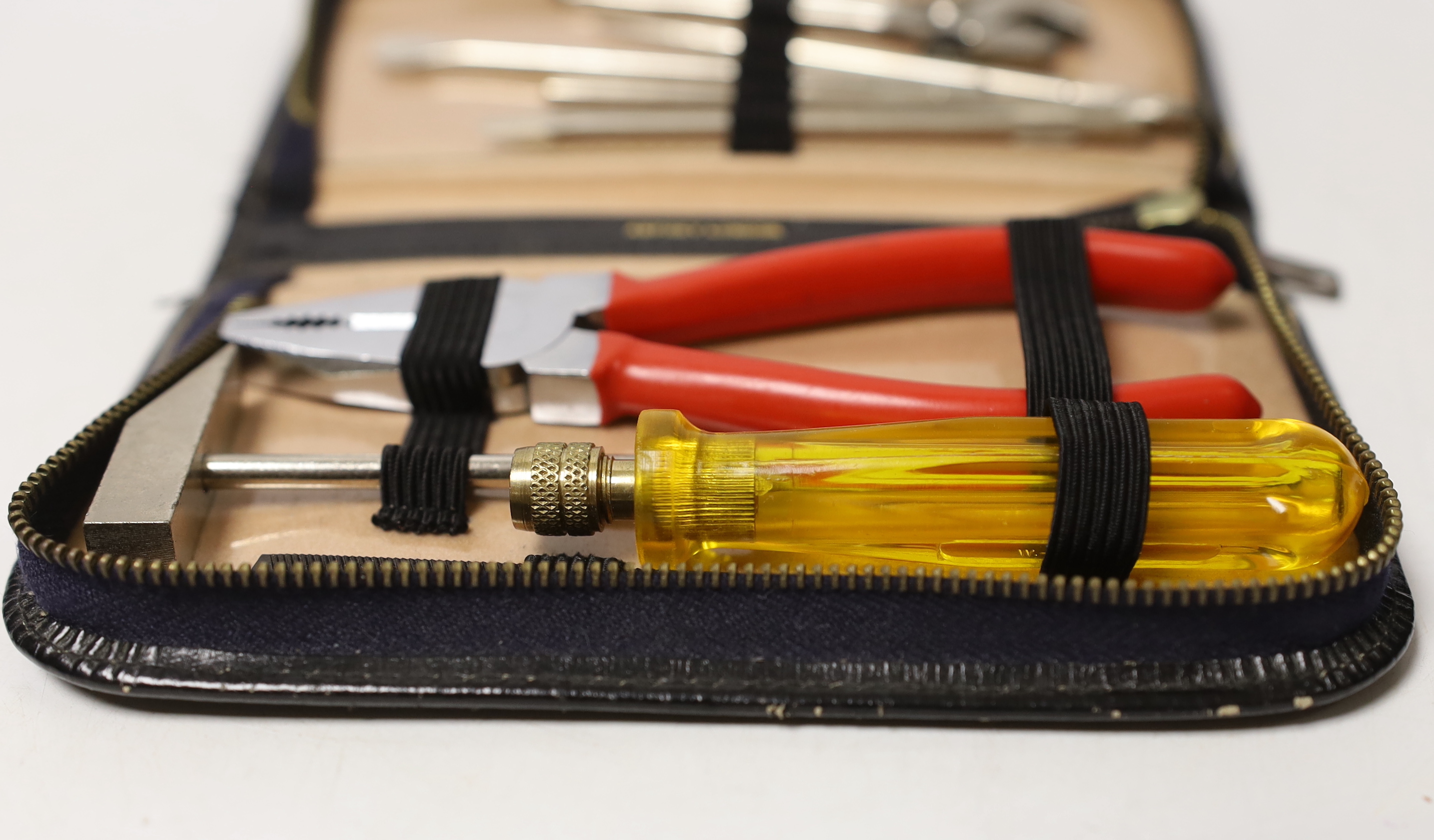 An Asprey case with associated tool set, case 17cm wide